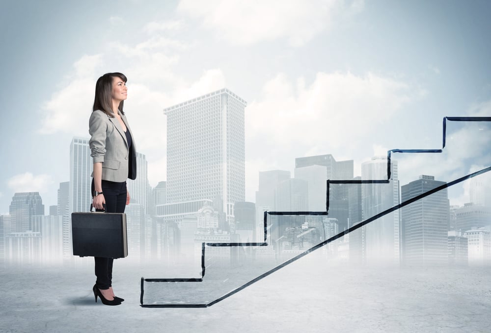 Business person in front of a staircase, city on the background Business person in front of a staircase, city on the background
